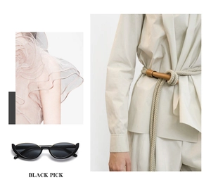 Occhiali da sole cat-eye neri alla moda mostrati con lookbook di stile e dettagli unici