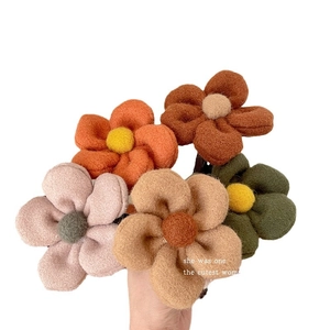 Felt flower hair claw clips in assorted autumn colors including orange and green