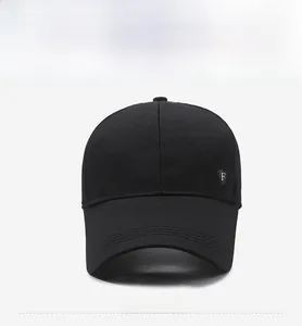 Front view of black breathable mesh baseball cap with silver metal shield F logo