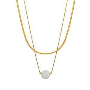 Gold double-layered necklace with sleek blade chain and white matte pearl pendant