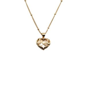 Close-up of gold heart pendant necklace with MOM lettering and zircon stones for Mother's Day