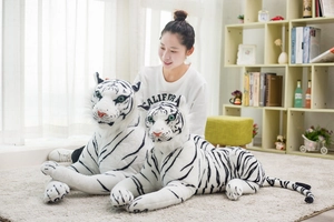 Macro detail of plush white tiger stuffed toy set showing soft faux fur and stripe texture