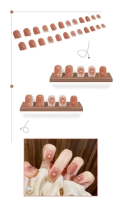 Macro view of gradient blush press-on nails with delicate heart patterns and gold flakes