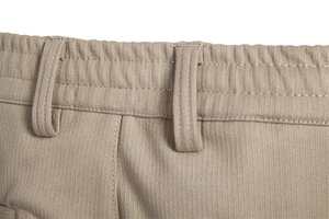 Detailed close-up of khaki business pants waistband stitching and fabric texture