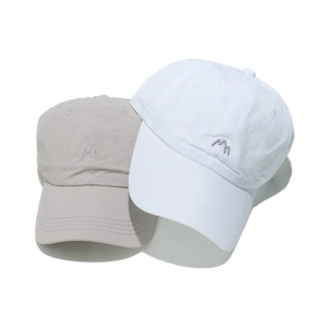 Detail of mountain embroidery on quick-dry baseball caps in white and light grey