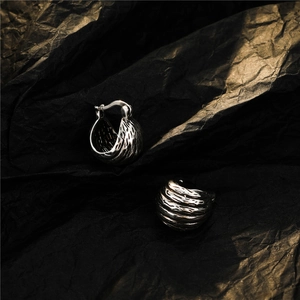 Vintage lava texture silver hoop earrings with irregular concave pattern in retro style