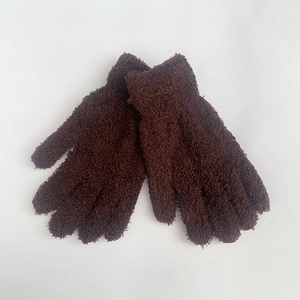 Detail of dark brown coral fleece gloves featuring thick plush texture and elastic cuffs