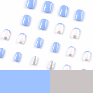 Short square blue and silver glitter press-on nails with french tip design on white background