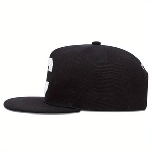 Classic black snapback hat with white embroidered letter S in a side profile view