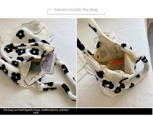 Detail view showing large interior capacity of daisy plush tote bag with daily items