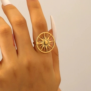 Detailed view of bohemian gold sunflower ring featuring radiating sunburst pattern on finger