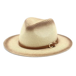Detail of gradient woven straw fedora featuring a brown leather band and metal buckle