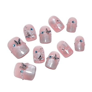 Pink cat eye press-on nails with 3D metal butterflies, rhinestones and pearls