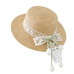 Handwoven straw sun hat featuring elegant white lace trim and light green silk bow detail
