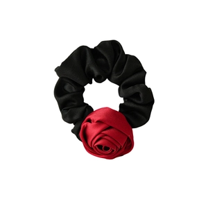 Elegant satin rose scrunchie with a large red flower and black pleated elastic hair tie