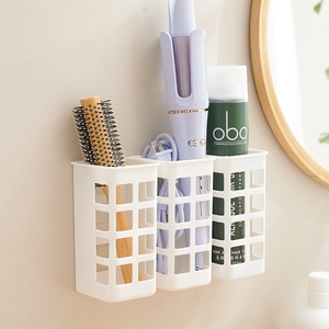 White wall-mounted bathroom organizers for hair curling irons and styling tools