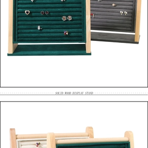 Close-up of velvet and solid wood jewelry stands for rings and earrings display