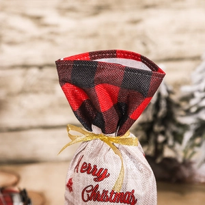 Christmas burlap wine bottle gift bag with red plaid design and golden ribbon
