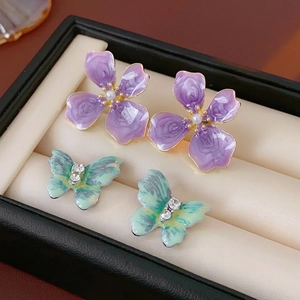 Vintage style butterfly and flower drop earrings with crystals and pearl details