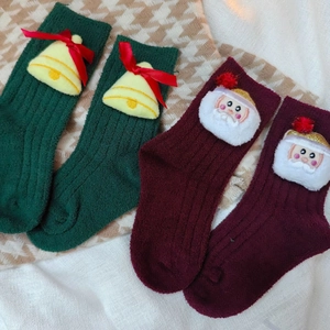 Thick Christmas socks for kids featuring 3D Santa and reindeer in red and green colors
