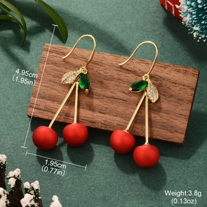 Retro cherry earrings with red fruit and green zircon leaves on festive wood stand