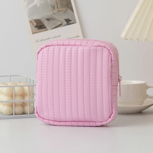Detail of pink PU leather pouch with vertical stitching and smooth metal zipper