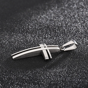 Polished stainless steel 3D hollow cross pendant with black stripe on dark background