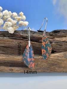 Detail shot of turquoise drop earrings with size markers 50mm by 14mm on wood
