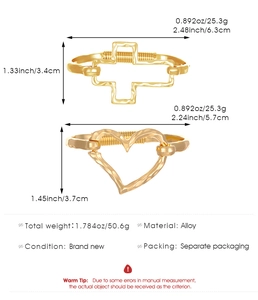 Detail of gold chunky cuff bracelets with hollow cross and heart designs and dimensions