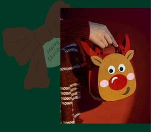 Detail of reindeer felt Christmas gift bag with 3D red nose and sturdy red handles