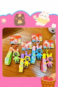 Details of four colorful mechanical rabbit astronaut keychains with soft PVC straps