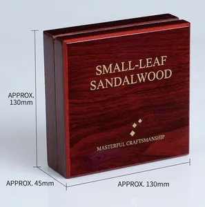 Macro shot of premium square rosewood gift box with elegant gold stamping and wood grain