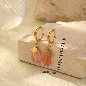 Detail showing dimensions of gold star earrings with pink oval natural stones