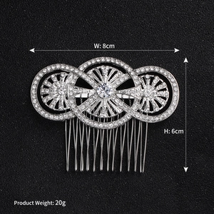 Macro detail of silver bridal hair comb showing 8x6cm dimensions and rhinestone inlay