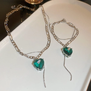 Double layer silver necklace and bracelet set with faceted green heart-shaped zircon stones