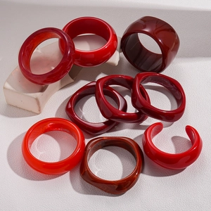 Set of chunky resin bangles in Ankara red and burgundy with irregular marble textures