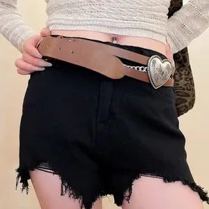 Vintage brown leather belt with large silver heart buckle and metal chain detail