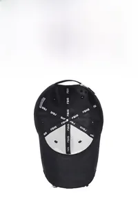Detailed interior of a distressed black baseball cap showing the reinforced seams and lining