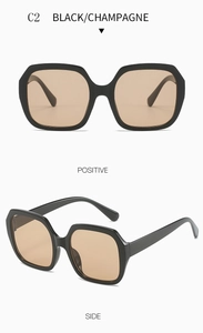 Oversized polygonal sunglasses with black frame and champagne lenses in front and side views