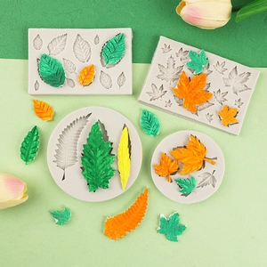 Leaf shaped silicone mold set for DIY cake fondant and chocolate on green background