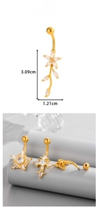 Detailed view of gold plated navel rings set with flower and cross zircon designs