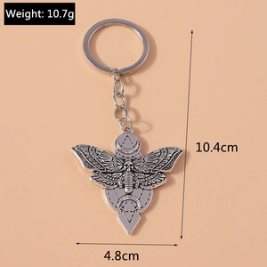 Detail view of silver moth skull keychain with dimensions 10.4cm x 4.8cm and 10.7g weight