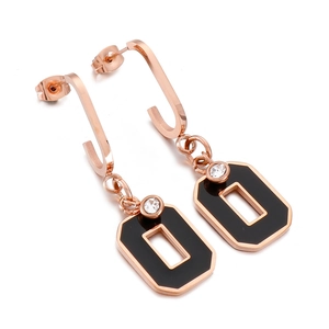 Elegant rose gold and black geometric earrings with sparkling diamond accent