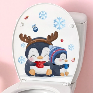 Close-up of Christmas penguin wall stickers applied on a white toilet lid decor