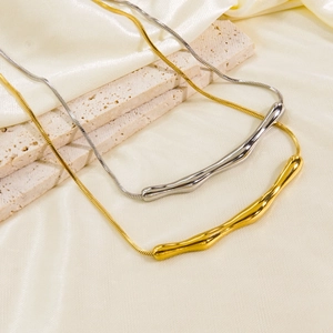Minimalist bamboo-style snake chain necklace in polished gold and silver finishes