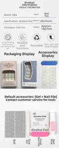 Long almond false nail kit with Halloween pumpkin motifs including glue and tools