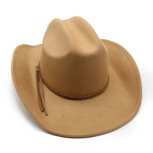 Detail of light brown western cowboy hat featuring braided band and side tassels decor