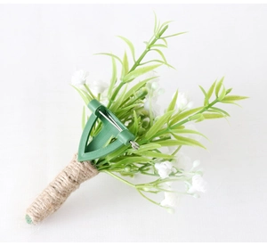 Detailed back view of a boutonniere with natural jute twine wrap and metal pin clip