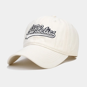 Detail of high-density cotton baseball cap with Athletics letter embroidery on creamy white fabric