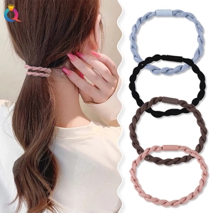 Detail of twisted high-elastic hair ties in blue, black, brown, and pink colors